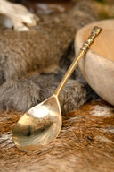 Średniowieczna mosiężna łyżka z głową dziewczyny