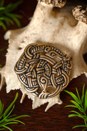 Urnesstijl schijffibula, brons