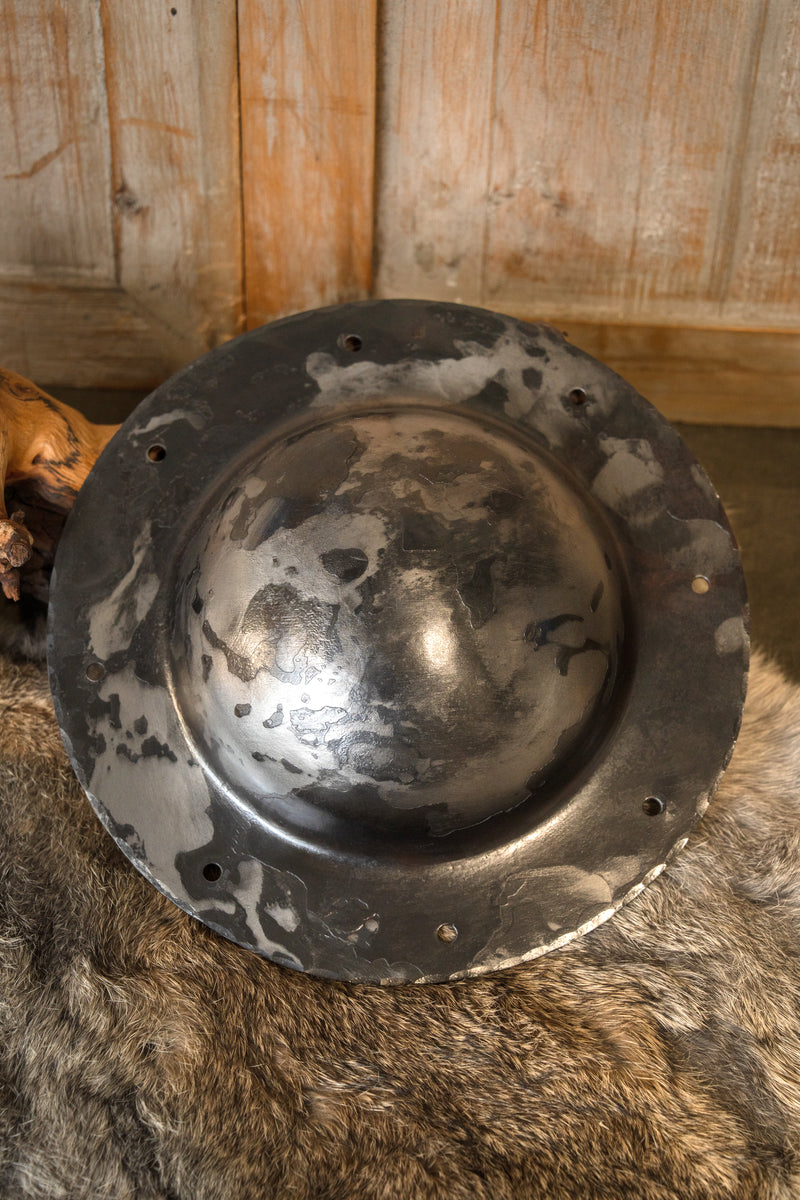 Hand beaten shield boss for round shield