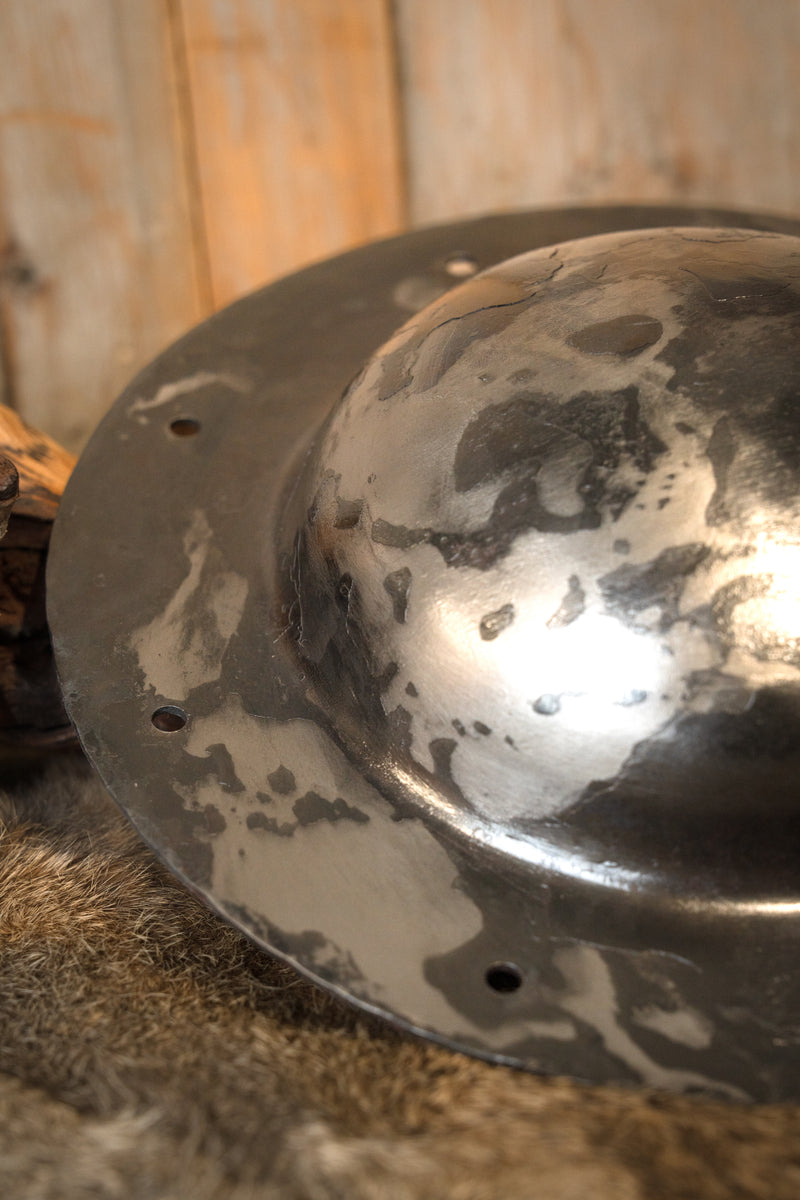 Hand beaten shield boss for round shield