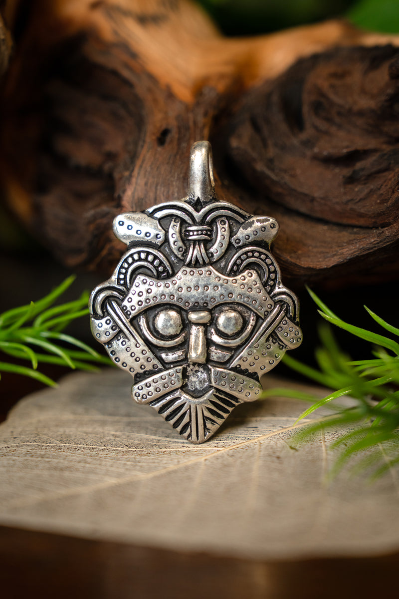 Gnezdovo mask amulet, silvered bronze