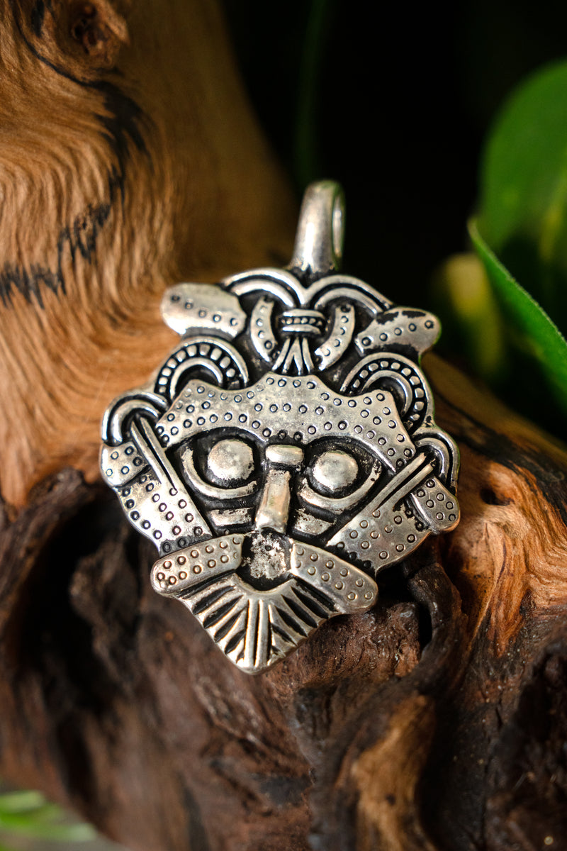 Gnezdovo mask amulet, silvered bronze