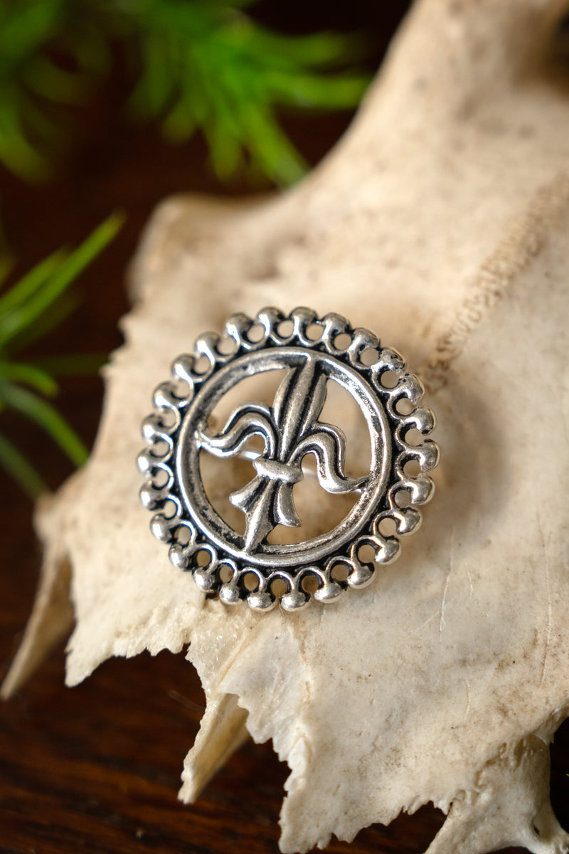 Medieval brooch fleur-de-Lys, silvered bronze