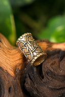 Cilindervormige baardkraal, brons