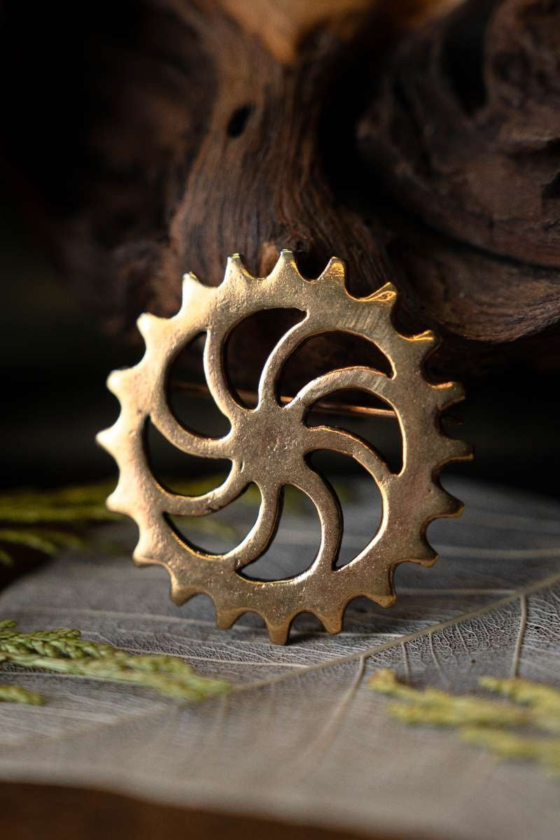 Römische Scheibenfibel Sonnenrad, Bronze 