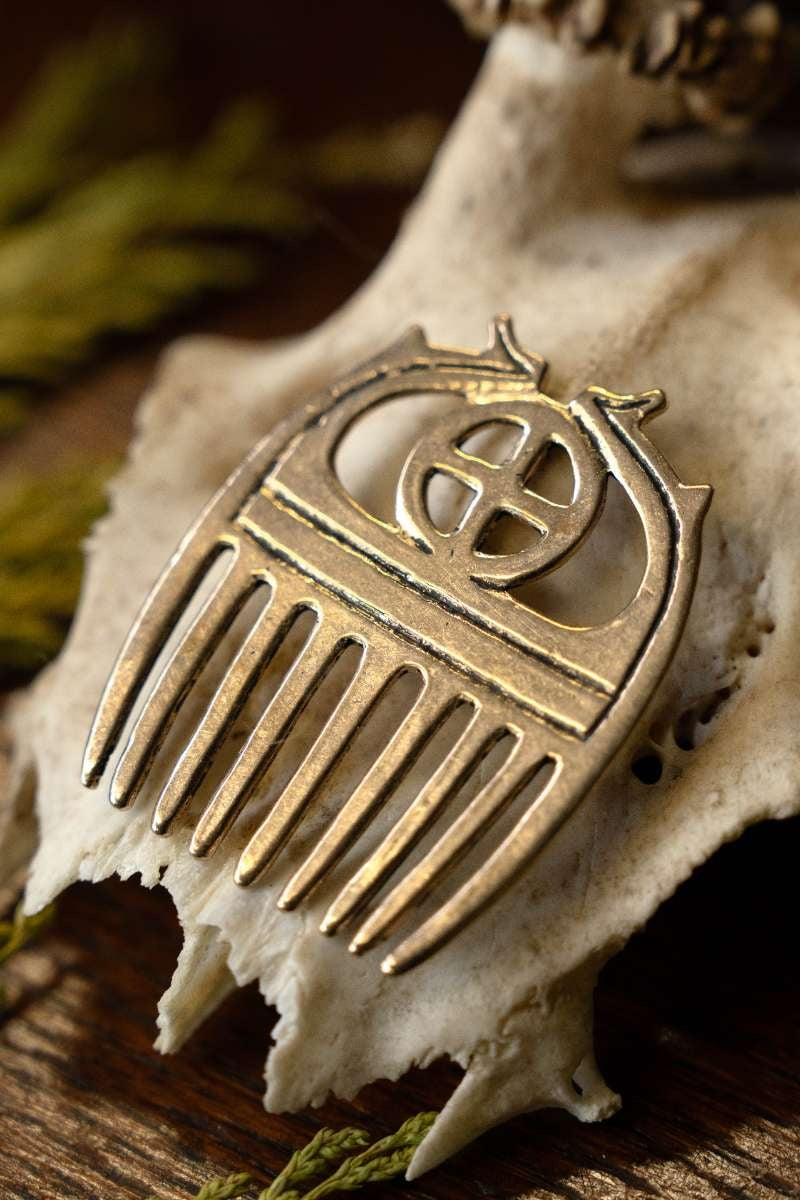 Bronze Age comb with sunwheel, bronze