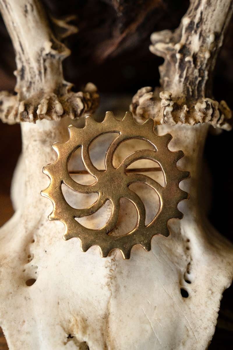 Römische Scheibenfibel Sonnenrad, Bronze 