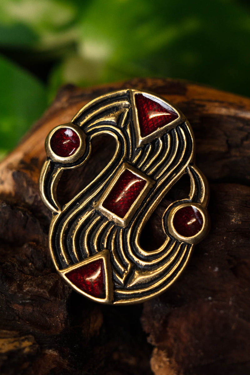 Merovingia S-fibula, bronce 